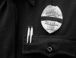 Police officer badge with black band